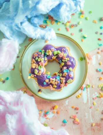 a mochi donut with sprinkles on a plate