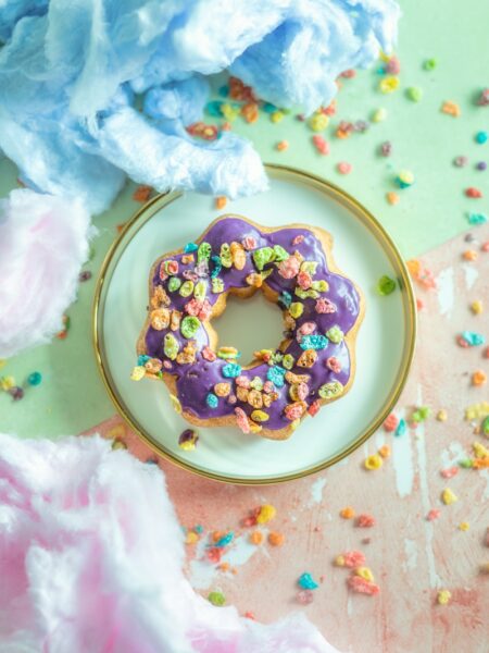 a mochi donut with sprinkles on a plate