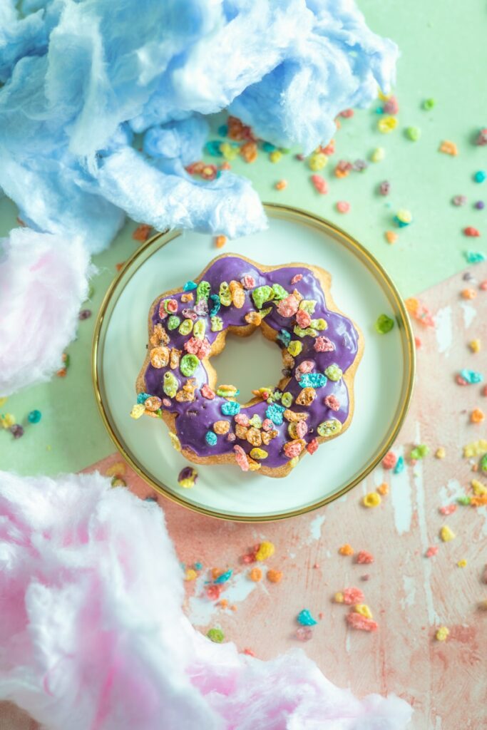 a mochi donut with sprinkles on a plate