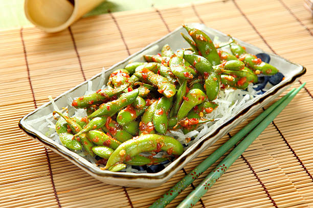 Appetizer Edamame soybeans with chopped garlic and Chili pepper, Japanese Vegetables