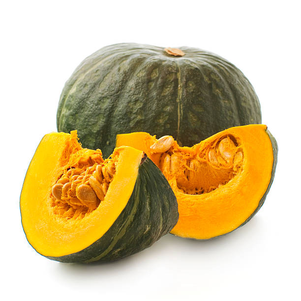 whole and sliced of Japanese pumpkin kabocha on a white background Japanese Vegetables