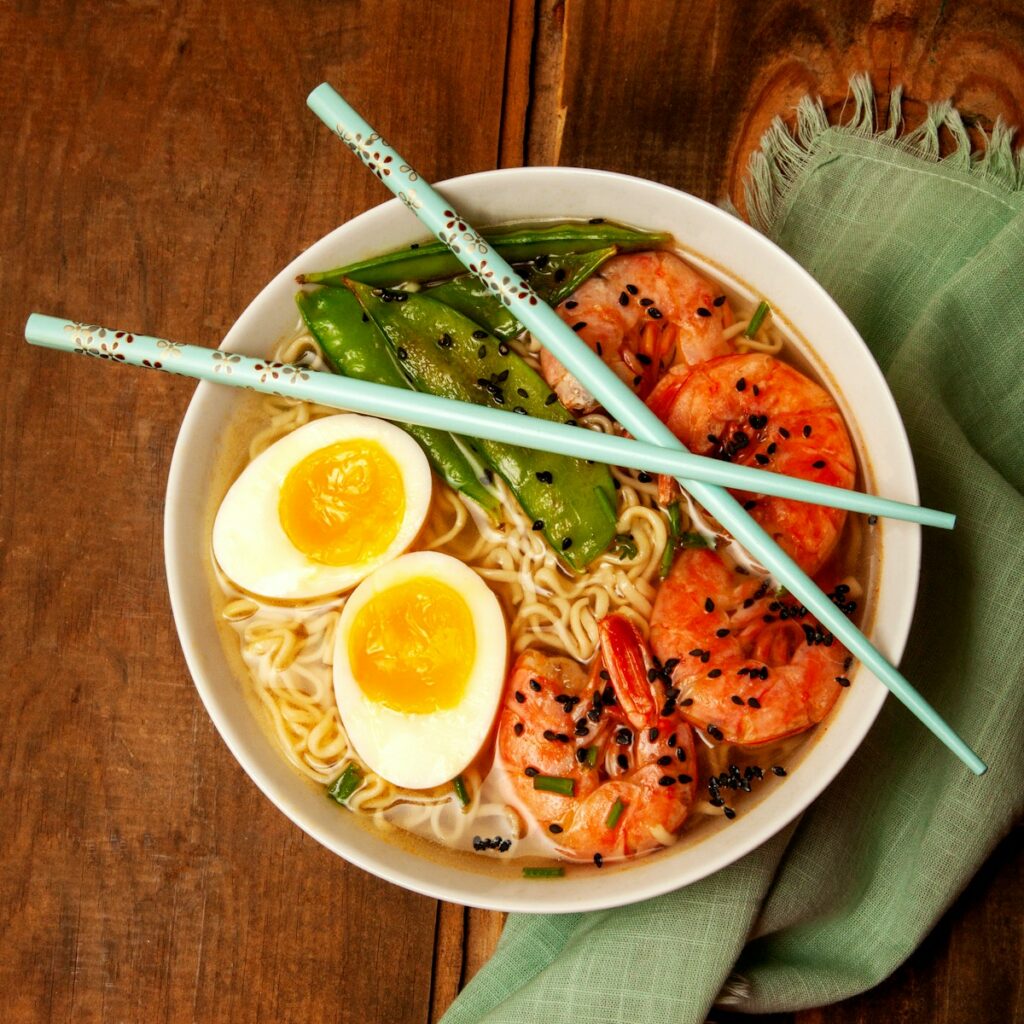 round white bowl with ramen and egg japanese foods