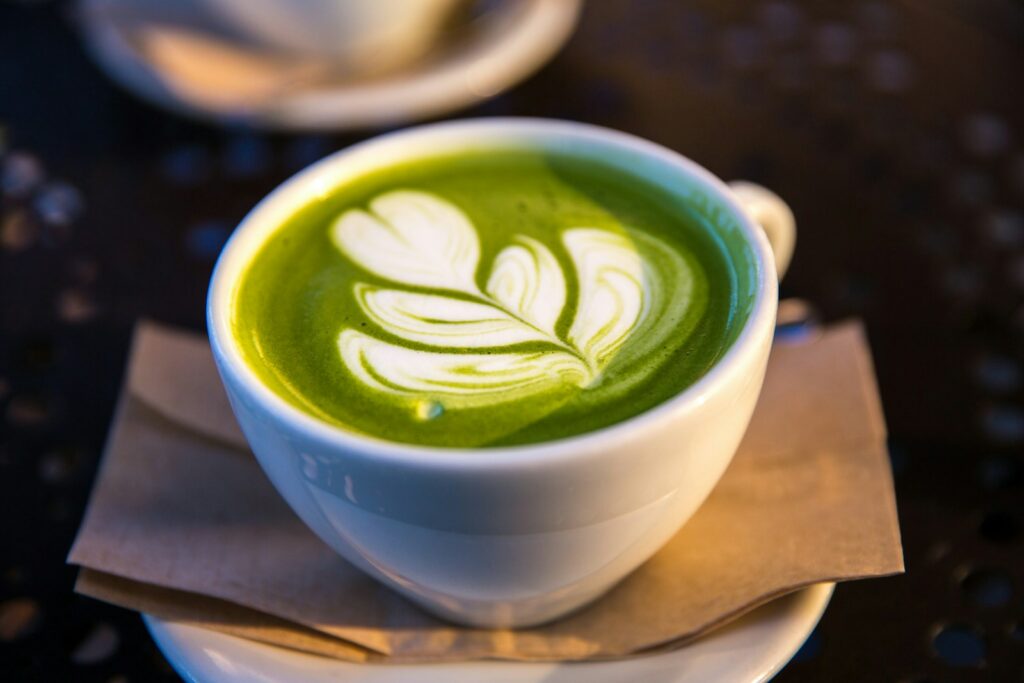 white ceramic teacup filled of matcha tea, matcha