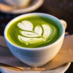 white ceramic teacup filled of matcha tea, matcha