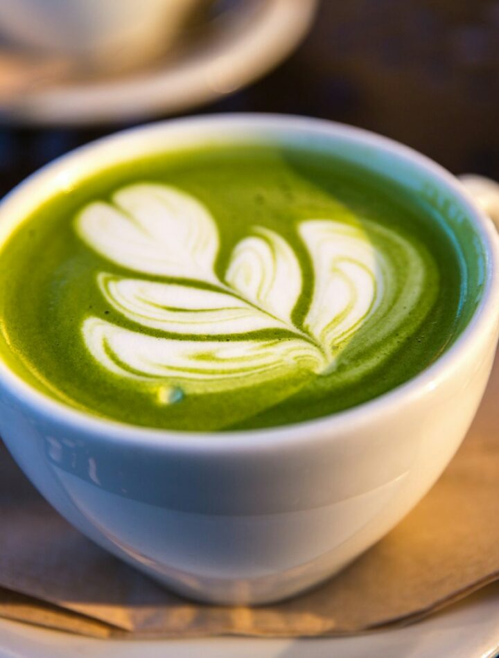 white ceramic teacup filled of matcha tea, matcha